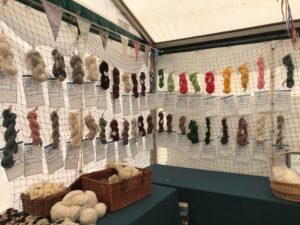 Display of 100 skeins of yarn spun by guild members