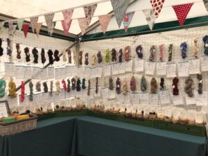 Display of 100 skeins of yarn spun by guild members